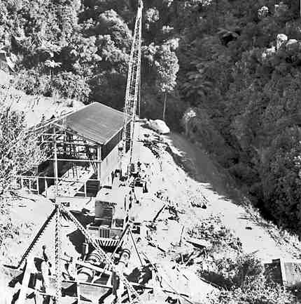 b. Karori Reservoir area, workmen installing pipes