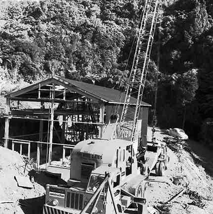 d. Karori Reservoir area, workmen installing pipes