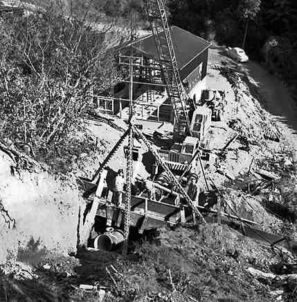 f. Karori Reservoir area, workmen installing pipes