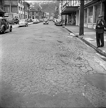 b. Views of streetscape, road surface, road works, machinery, motor vehicles, people, street signs, commercial buildings, Foresters Arms Hotel