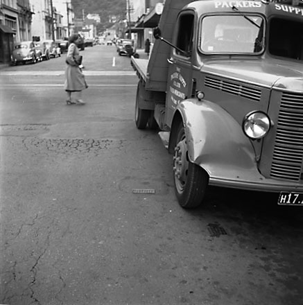 c. Views of streetscape, road surface, road works, machinery, motor vehicles, people, street signs, commercial buildings, Foresters Arms Hotel