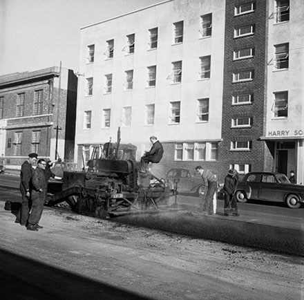 b. Workmen, machinery