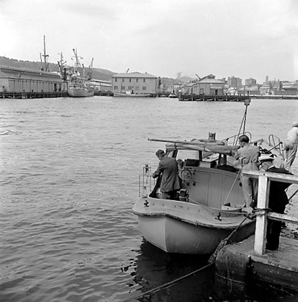 c. Views of pilot boat moored at wharf