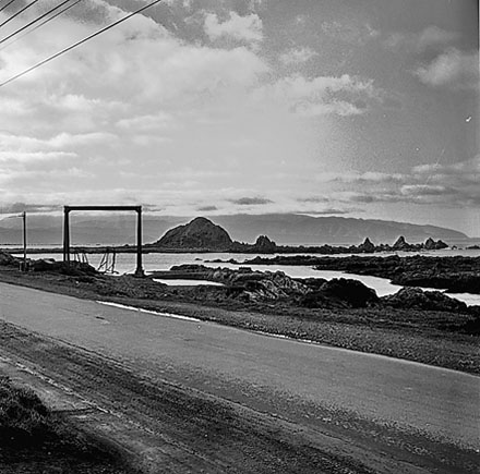 a. Views of coastline from beach, Taputeranga Island in background