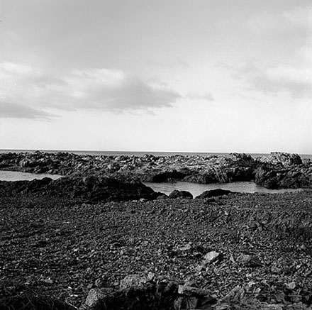 i. Views of coastline from beach, Taputeranga Island in background