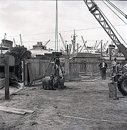 c. Views of workmen, equipment, excavating machinery