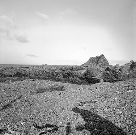 k. Views of coastline from beach, Taputeranga Island in background
