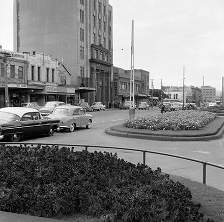 a. Elevated views of the north end of Cambridge and Kent Terrace, taxi stands, Embassy Theatre, motor vehicles, billboard for 'Mobil Oil'