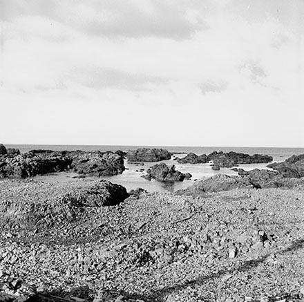 l. Views of coastline from beach, Taputeranga Island in background