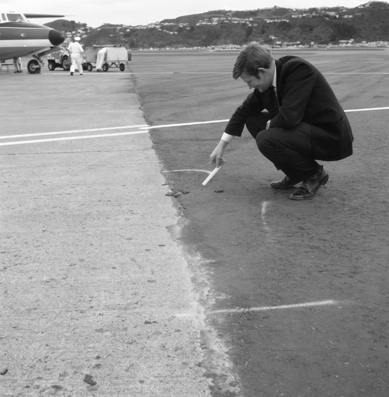 b. Wellington Airport, paving failure at feather edging by hardstanding at gates 6-7