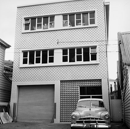 c. Views of the commercial / industrial area around the Hutt Road and Kaiwharawhara Road intersection. Warehouses, dwellings, BP Service Station, motor vehicles, Kaiwarra Wool Store, Wm Cable Ltd