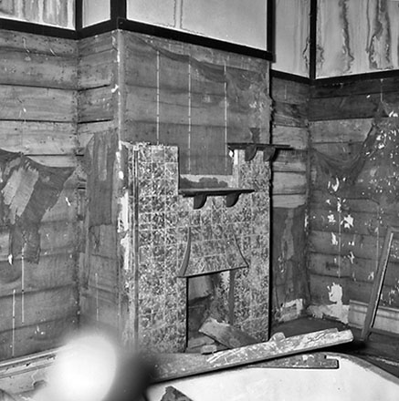 b. 9 Mein Street, a single-storey wooden building