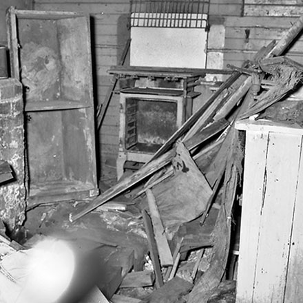 e. 9 Mein Street, a single-storey wooden building