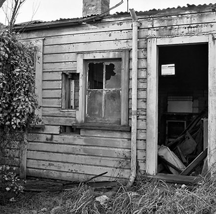 f. 9 Mein Street, a single-storey wooden building