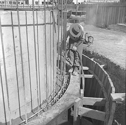 b. Road works being carried out by workmen, using excavating machinery, graders, trucks, Ghuznee Street from corner of Taranaki Street