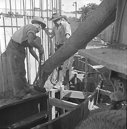 b. Workmen constructing drainage system