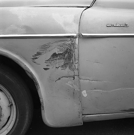 b. Damaged Motor Vehicle