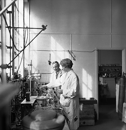 b. Interior of Council laboratory, people at work. d. Slip, unidentified property