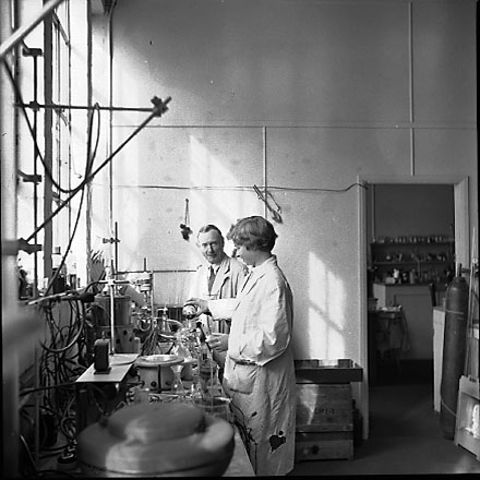 c. Interior of Council laboratory, people at work. d. Slip, unidentified property