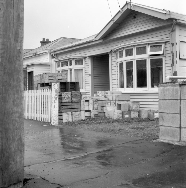 f. No 44 Owen St, Uneeda Fruit Co. large stacks of empty fruit boxes