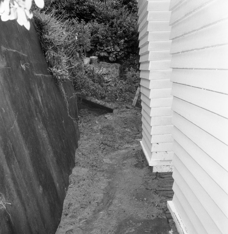 a. No 152 Barnard St. scouring of bank and rubble left by downpour