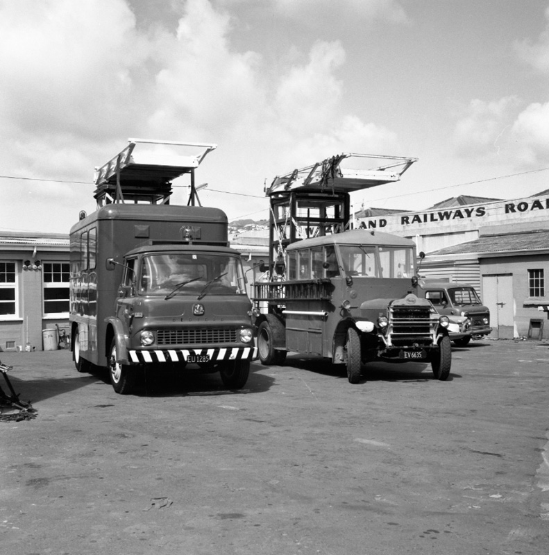 d. Daimler overhead repair truck no. 15 and Bedford overhead repair truck no. 11