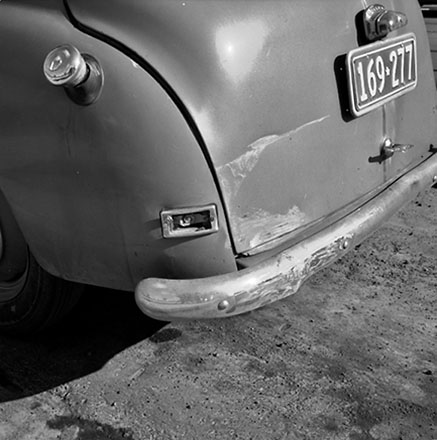 a. Damaged motor vehicle parked in Cuba Street, Car No. 169-277