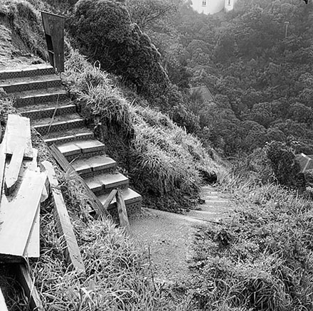 a. Streetscape showing damage to foot path caused by heavy machinery, multi storey apartment block at 312-320 The Terrace
