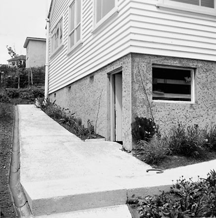 b. Views of a single storey wooden dwelling, possibly a Council House