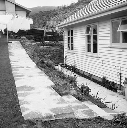 c. Views of a single storey wooden dwelling, possibly a Council House