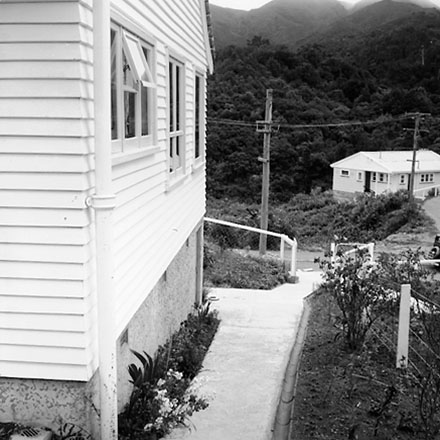 d. Views of a single storey wooden dwelling, possibly a Council House