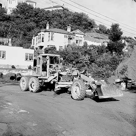 d. Streetscape showing damage to foot path caused by heavy machinery, multi storey apartment block at 312-320 The Terrace