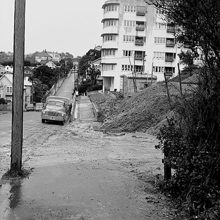 e. Streetscape showing damage to foot path caused by heavy machinery, multi storey apartment block at 312-320 The Terrace