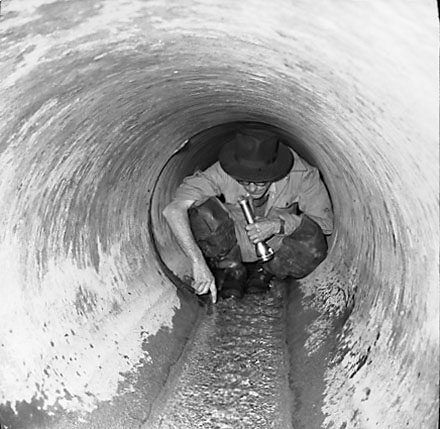 a. Workman inside drain, Tauhinu Road