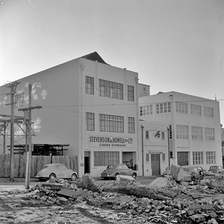 f. Unidentified location, a three storey concrete commercial building, Stevenson and Howell Ltd
