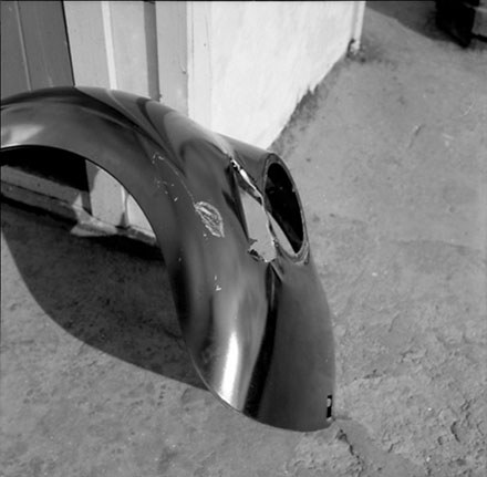 d. [part from vehicle or motorbike]