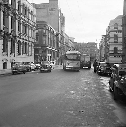 b. Trolley bus passing a Diesel bus, Chews Lane on the left, Kodak House in the background
