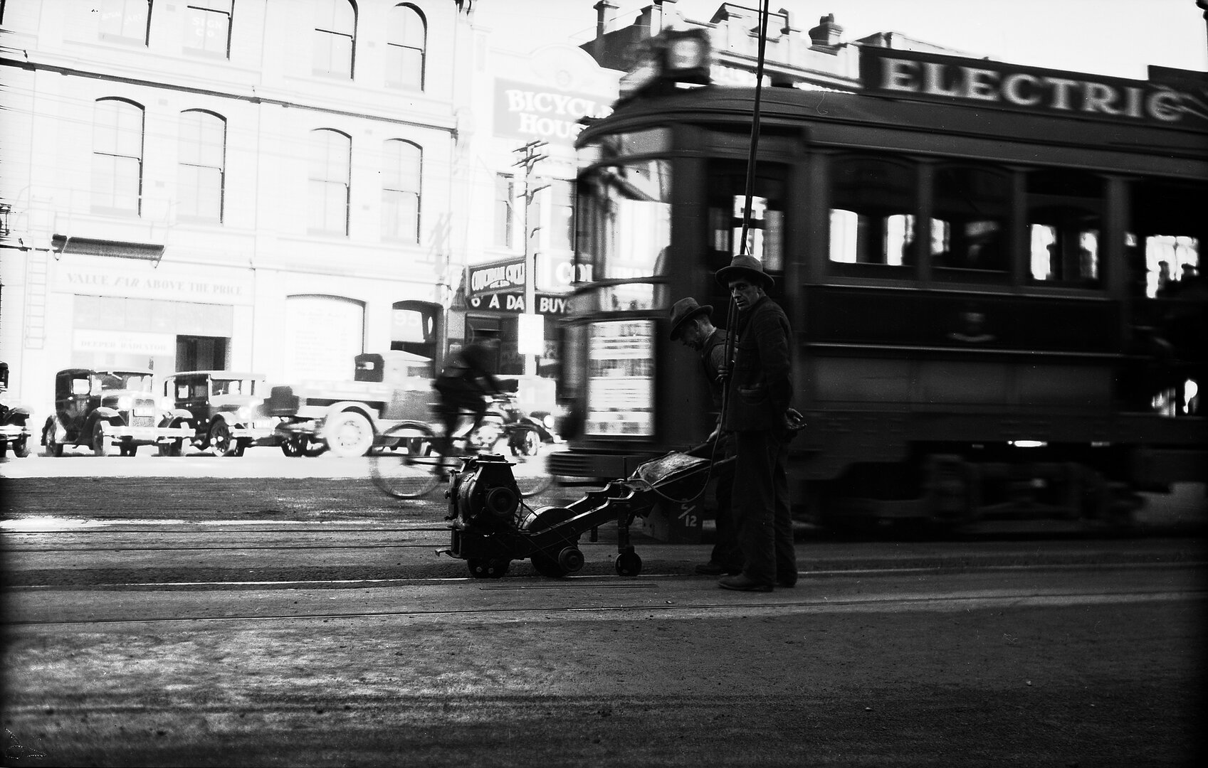 Courtenay Place, workmen using Celerity Grinder