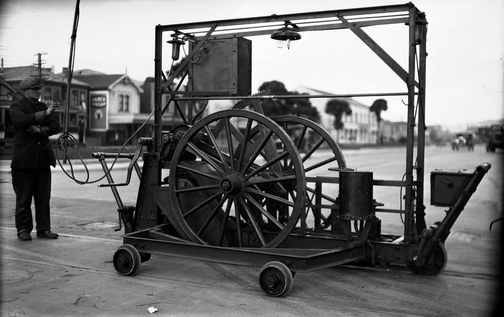 Cambridge Terrace and Vivian Street, workmen with a Reciprocating Grinder