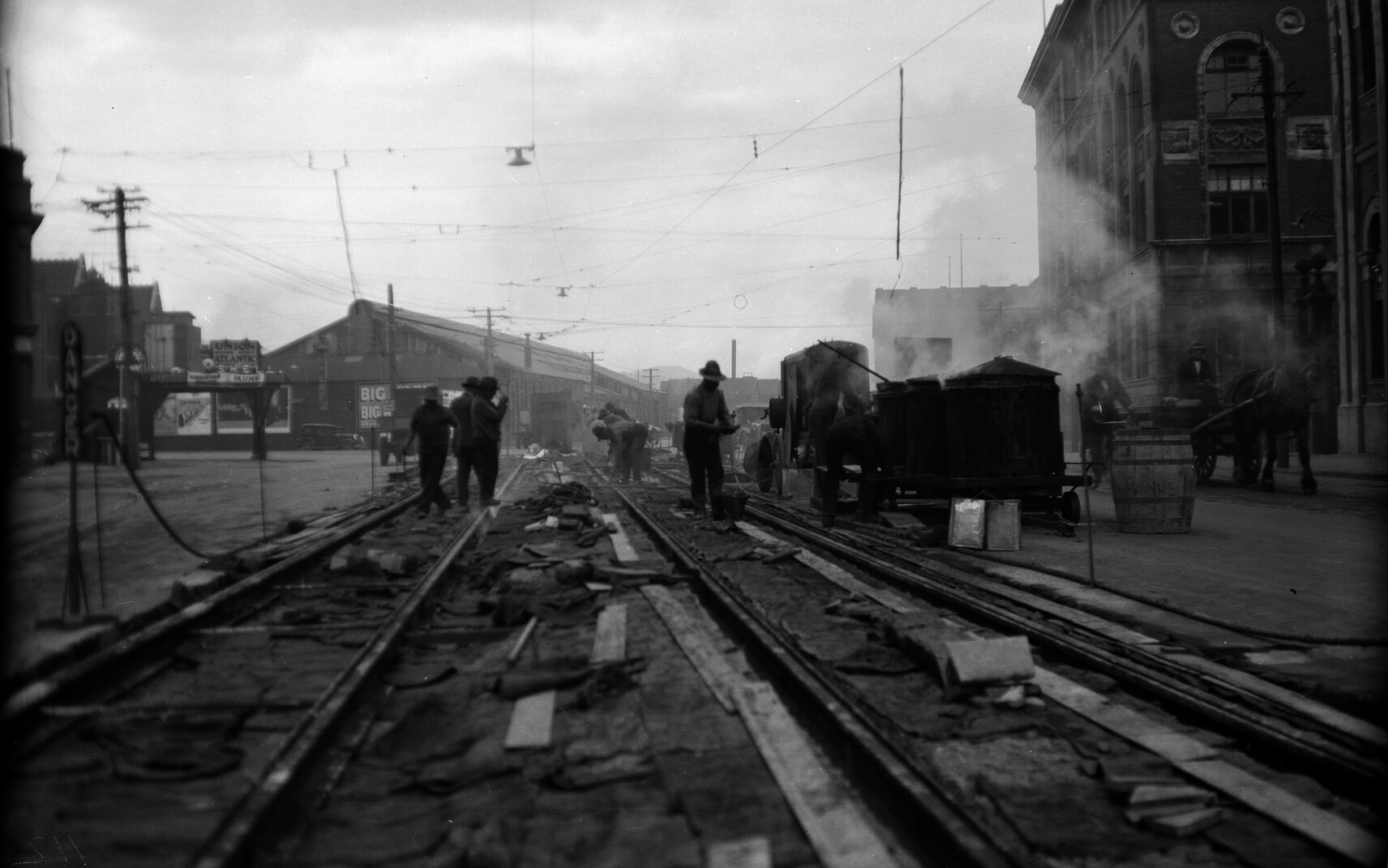 Customhouse Quay, opposite Ballance Street, workmen and newly laid tram rails prior to concreting