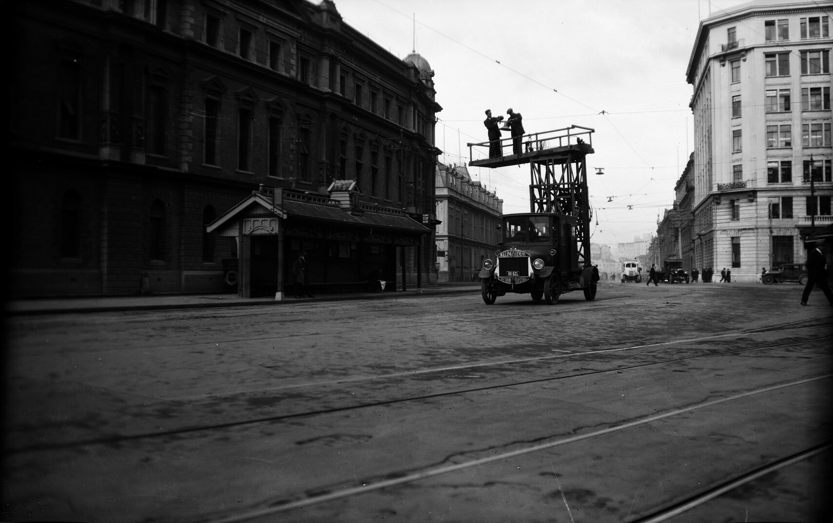 Customhouse Quay, opposite Post Office Square, workmen on Overhead Wagon working on overhead tramlines