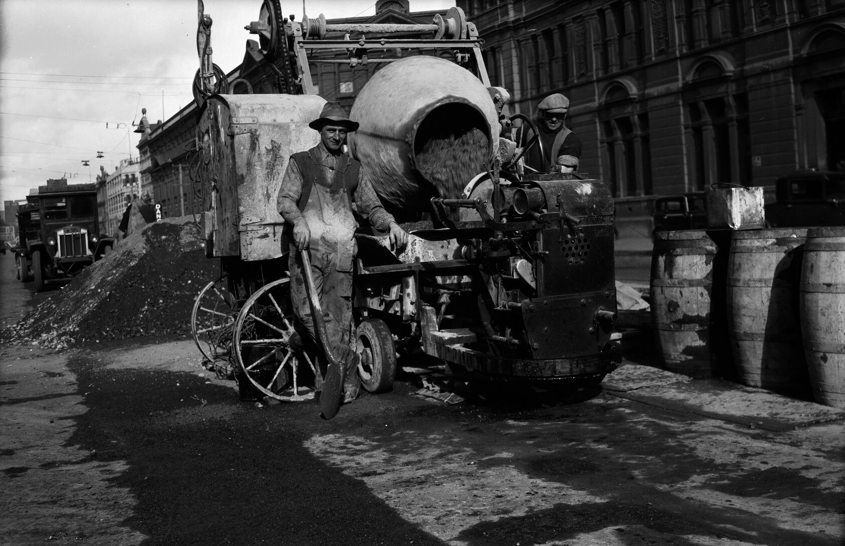 Jervois Quay, workmen pouring concrete into tipper on Lister Truck