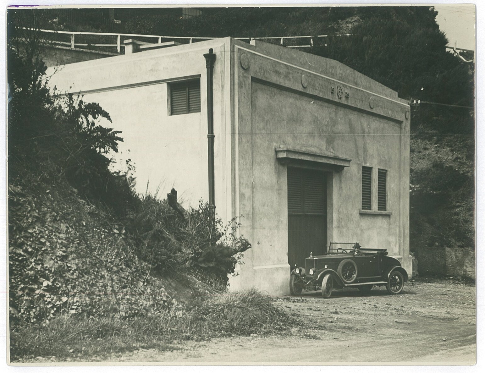 1920s car outside a substation