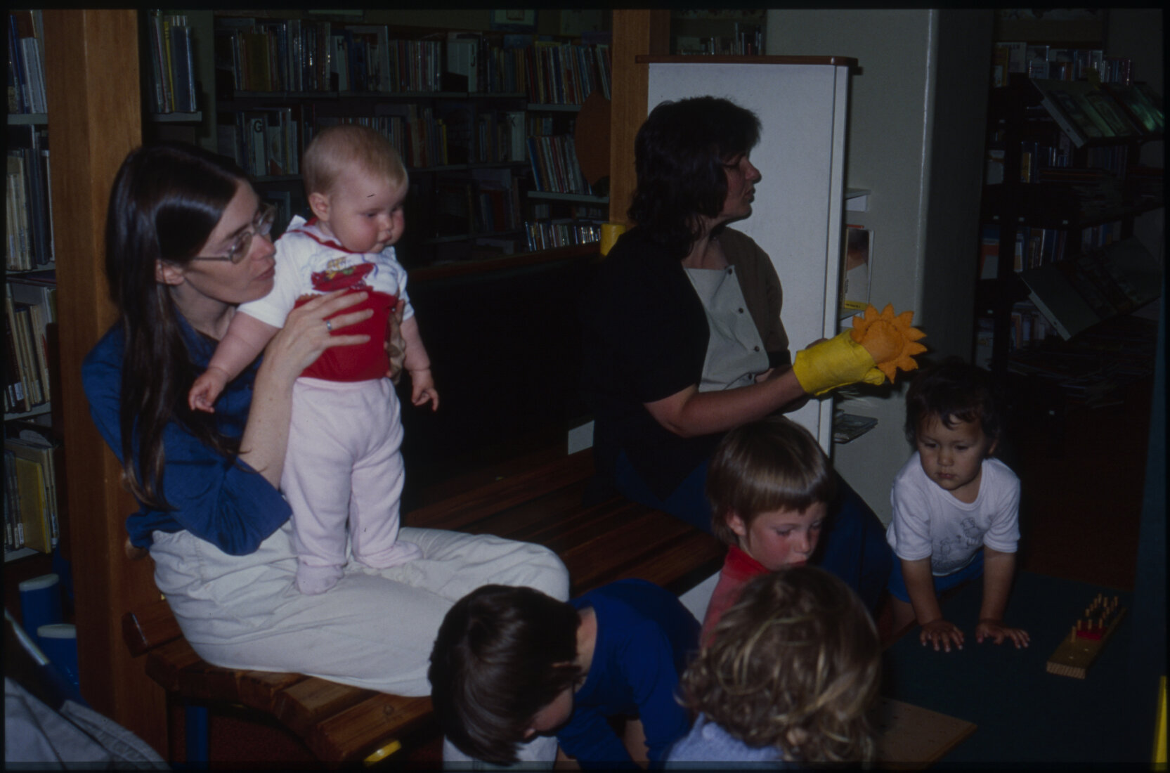 Children playing indoors (possibly Library)