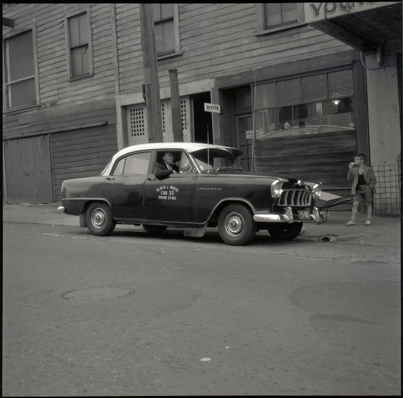 g. Black and White Cabs, taxi, motor vehicle parked outside office on John Street (R Shields driver)