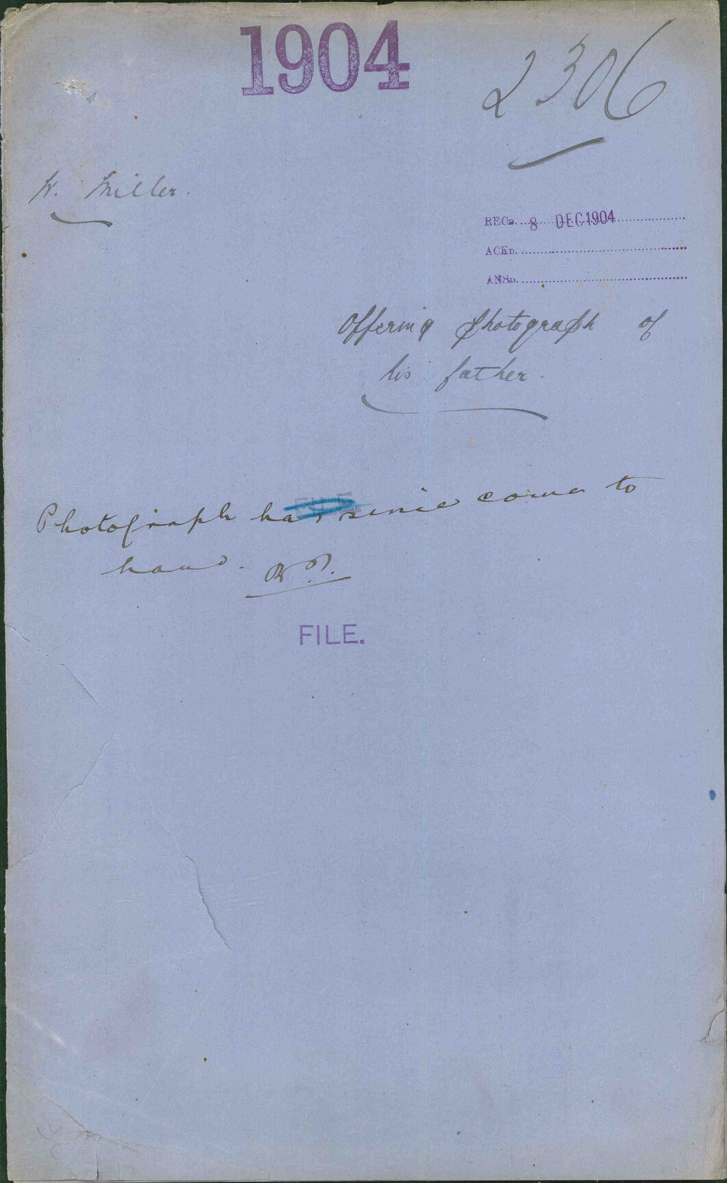 Offering photograph of his father - W Miller