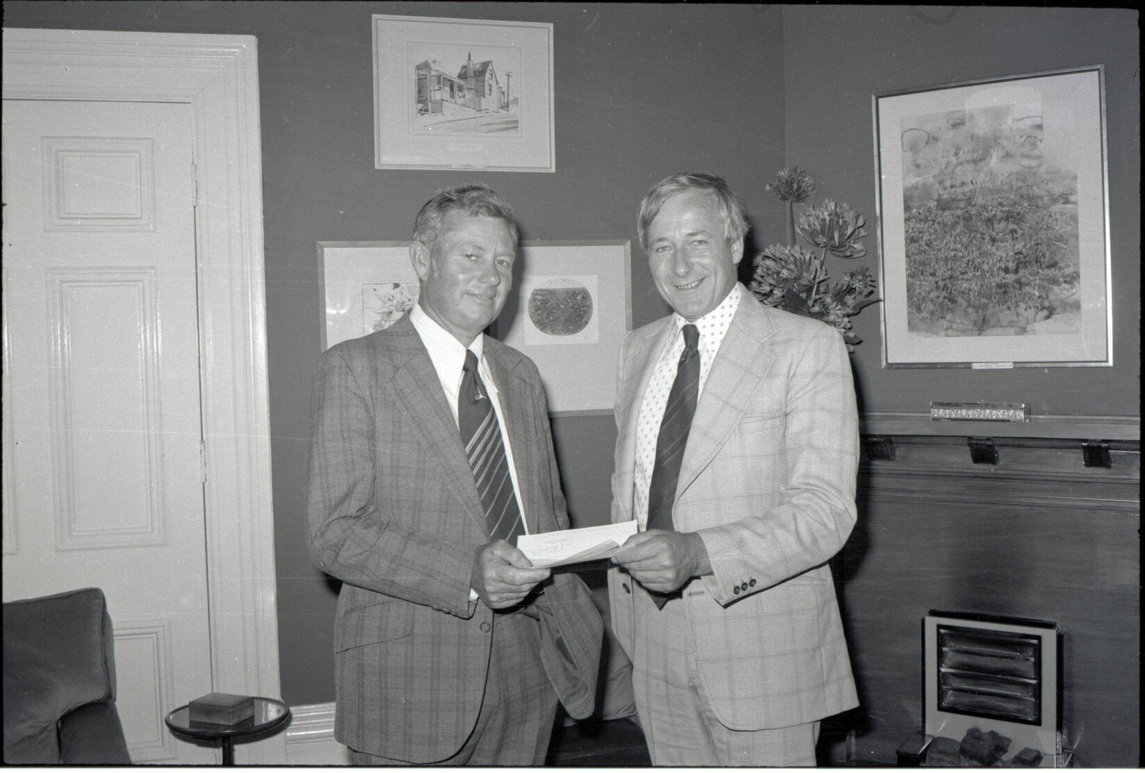 Mayor Fowler receiving cheques from Bank representatives