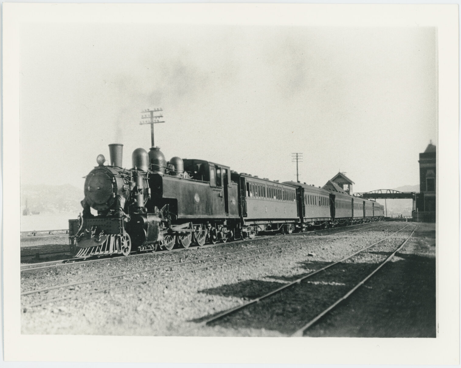 Train leaving Kaiwharawhara Railway Station, view looking south