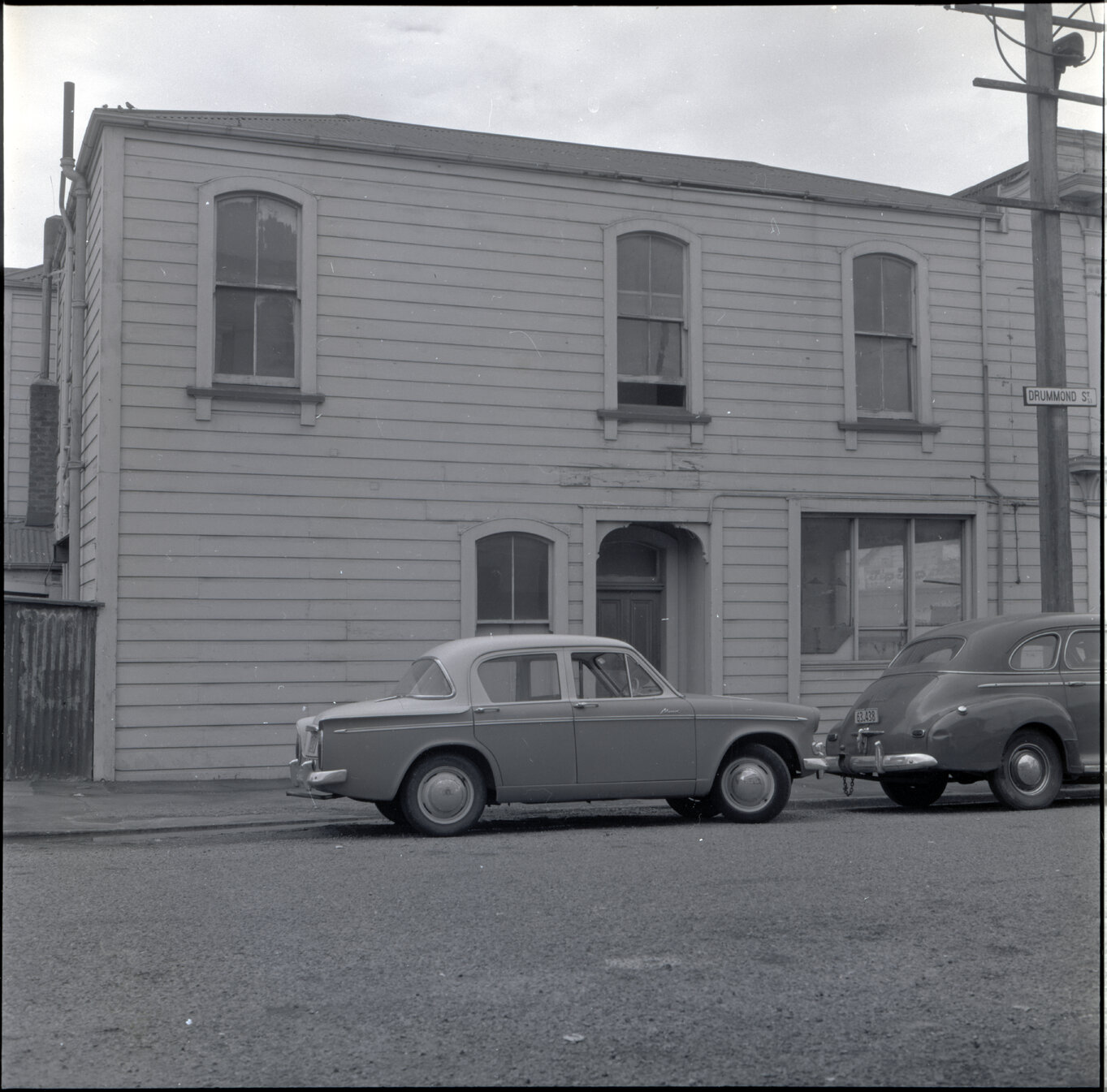 f. Sub-standard building, Drummond Street, a two story wooden building