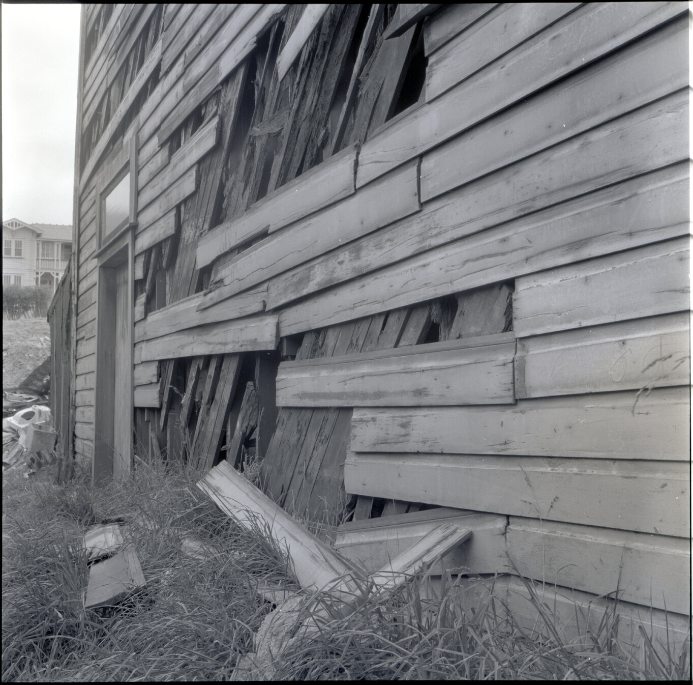 k. Sub-standard building, Drummond Street, a two story wooden building